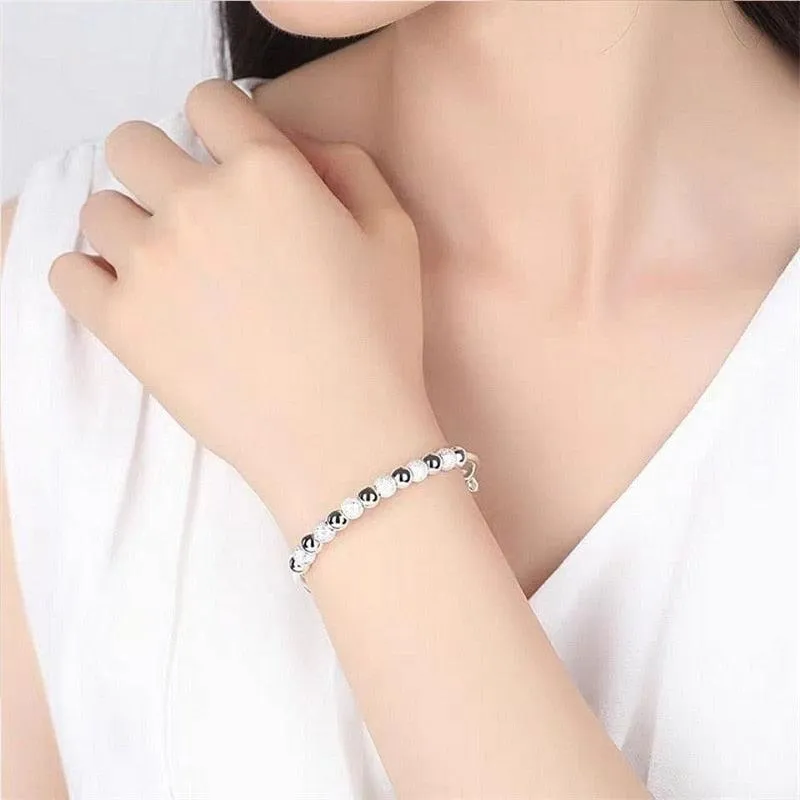SILVER CHARM BANGLE BRACELET